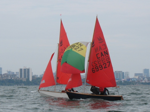 Photo: Heather and Terry are very Close on the Downwind Leg