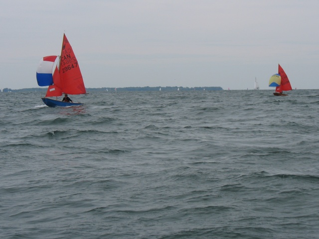Photo: Mat and Don Pass Charger with Spinnakers Flying on the Downwind Leg