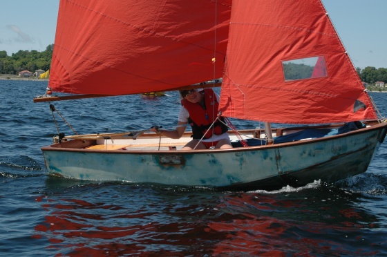 Photo: Kayley Says Hello as She Passes the Committee Boat