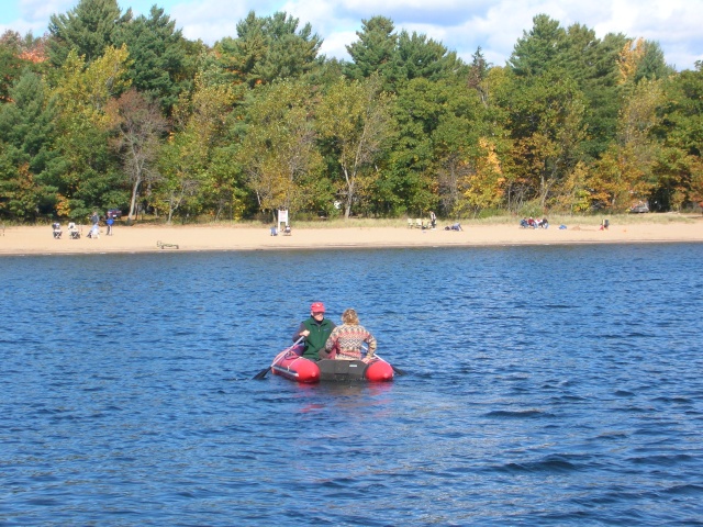 Photo: Wim and Alison Rowing to Shore for Cocktails