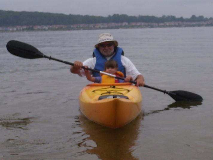 Photo: Aleid Teaches Taya to Paddle a Kayak