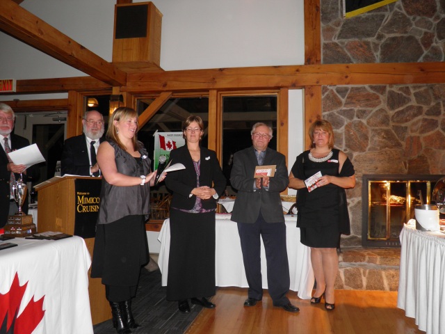 Photo: The Victoria Day Regatta Winners: Marika (accepting on behalf of Don), Heather and Steve