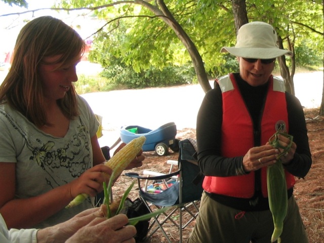 Photo: Natalie and Joanna Shucking Corn