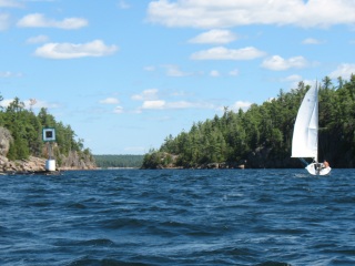 Photo: A Sailboat Heads Through the Hole in the Wall ...