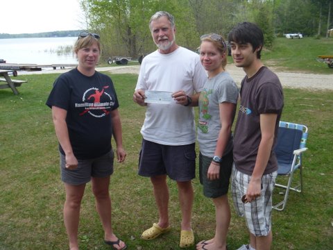 Photo: Don, Heather and Brandon Accept a Contribution from OMDA for Their Trip to the Worlds