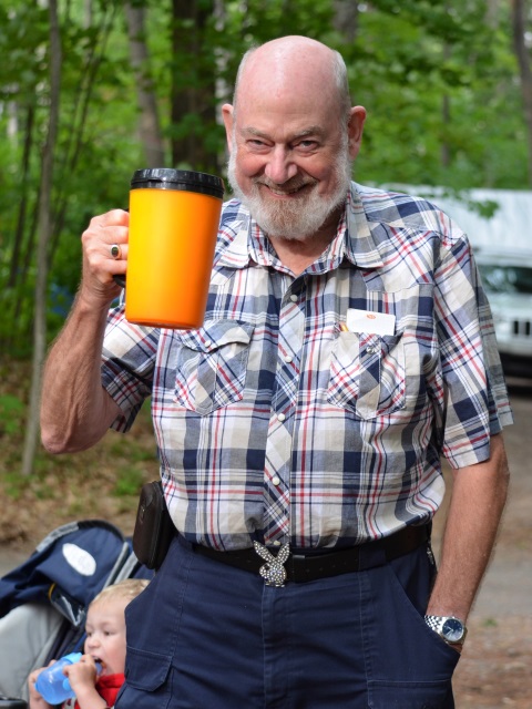 Photo: John Raises His Glass (and Develops Some Muscle)